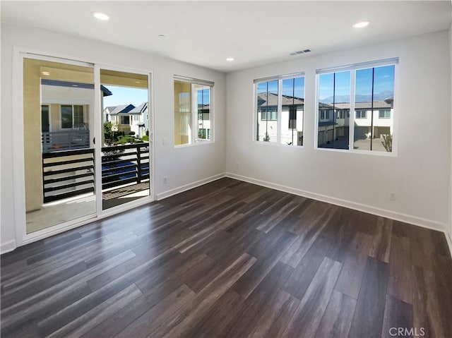 3622 E Delight Paseo Unit 112, Ontario, CA 91761 - spare room with dark wood-type flooring, recessed lighting, baseboards, and visible vents