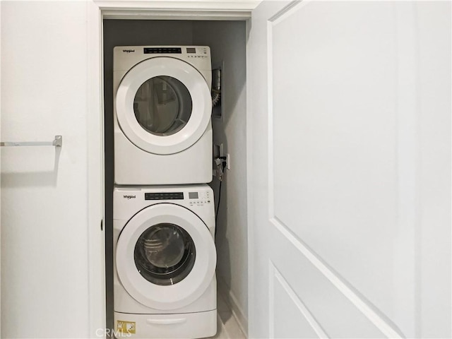 3622 E Delight Paseo Unit 112, Ontario, CA 91761 - washroom featuring laundry area and stacked washer / drying machine