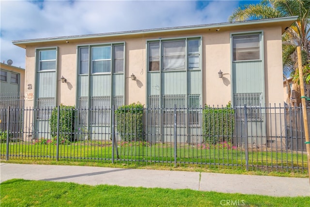 exterior space with a fenced front yard