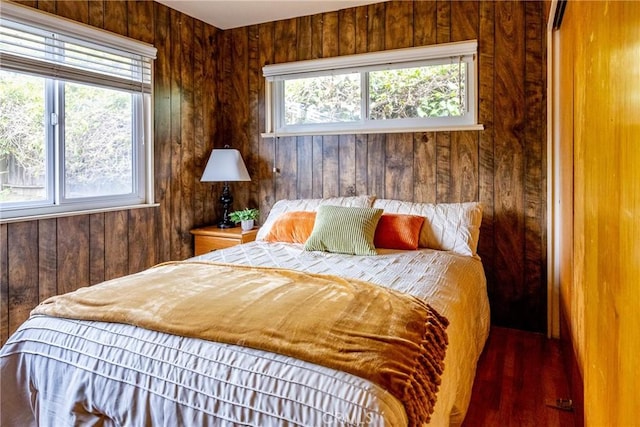 bedroom with wood walls