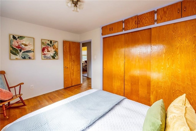 bedroom with a closet and wood finished floors