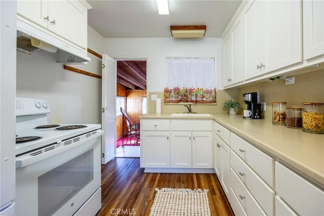 kitchen featuring under cabinet range hood, white electric range, dark wood-style flooring, a sink, and light countertops