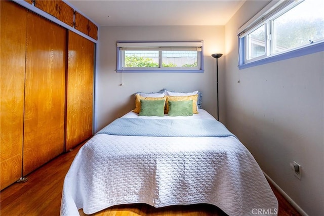 bedroom featuring a closet and wood finished floors