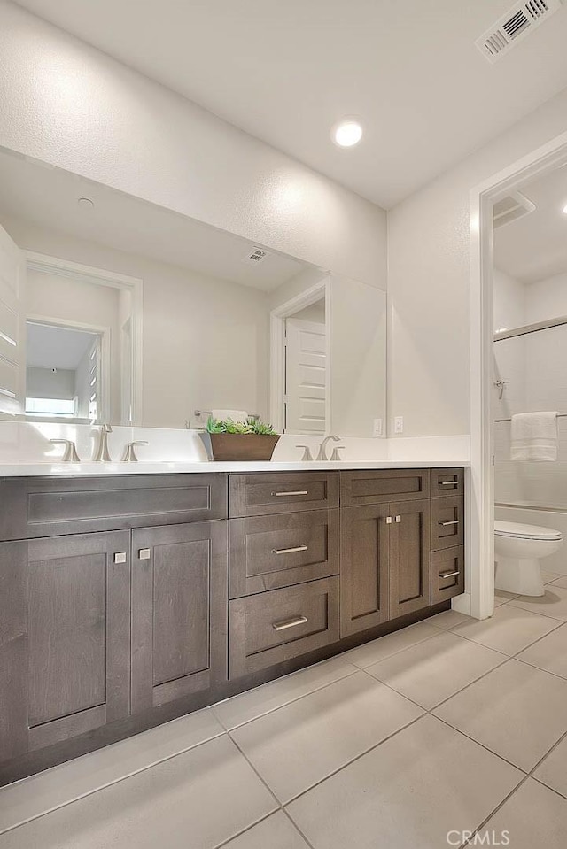 114 Source, Irvine, CA 92618 - bathroom featuring double vanity, tile patterned flooring, and a shower