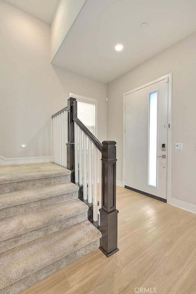 114 Source, Irvine, CA 92618 - entrance foyer with light wood finished floors, baseboards, stairs, and recessed lighting