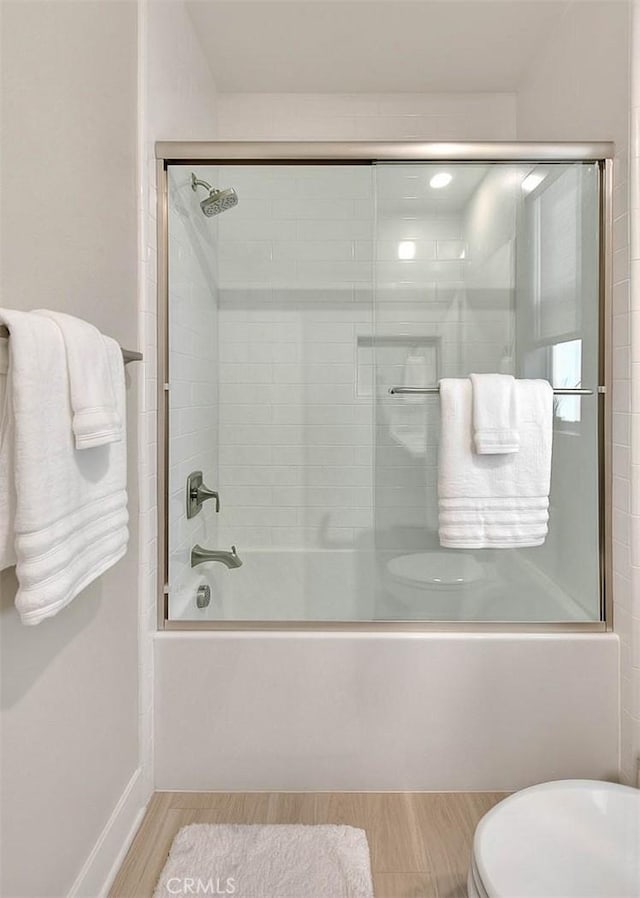 114 Source, Irvine, CA 92618 - full bathroom featuring toilet, wood finished floors, and enclosed tub / shower combo