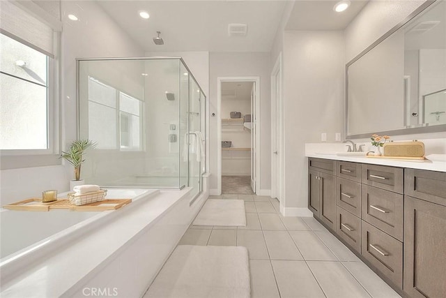 114 Source, Irvine, CA 92618 - full bathroom featuring a stall shower, vanity, a bath, tile patterned flooring, and recessed lighting