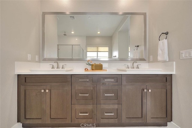114 Source, Irvine, CA 92618 - bathroom with double vanity, a shower, and baseboards