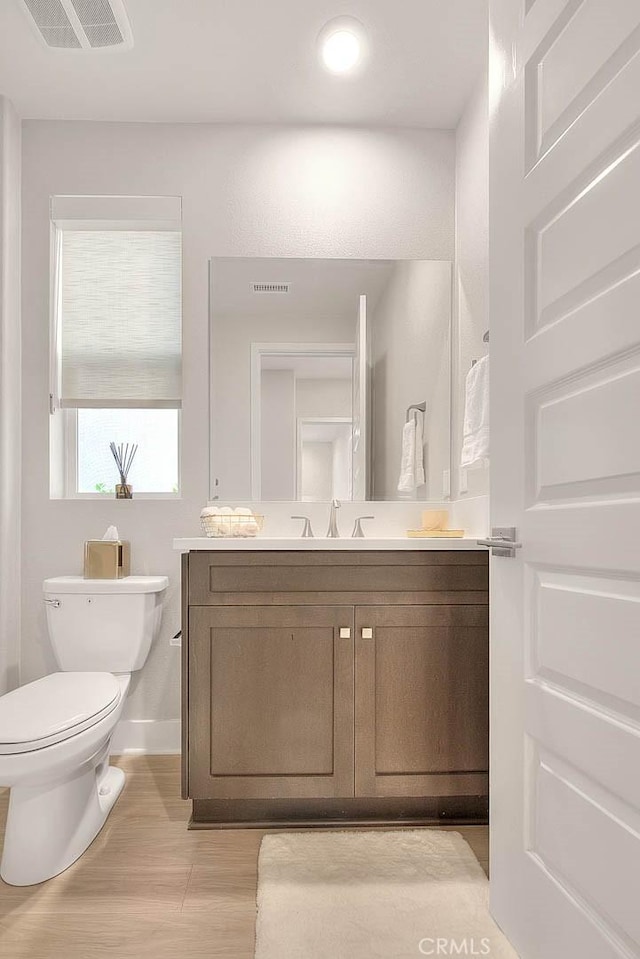 114 Source, Irvine, CA 92618 - bathroom featuring vanity and wood finished floors