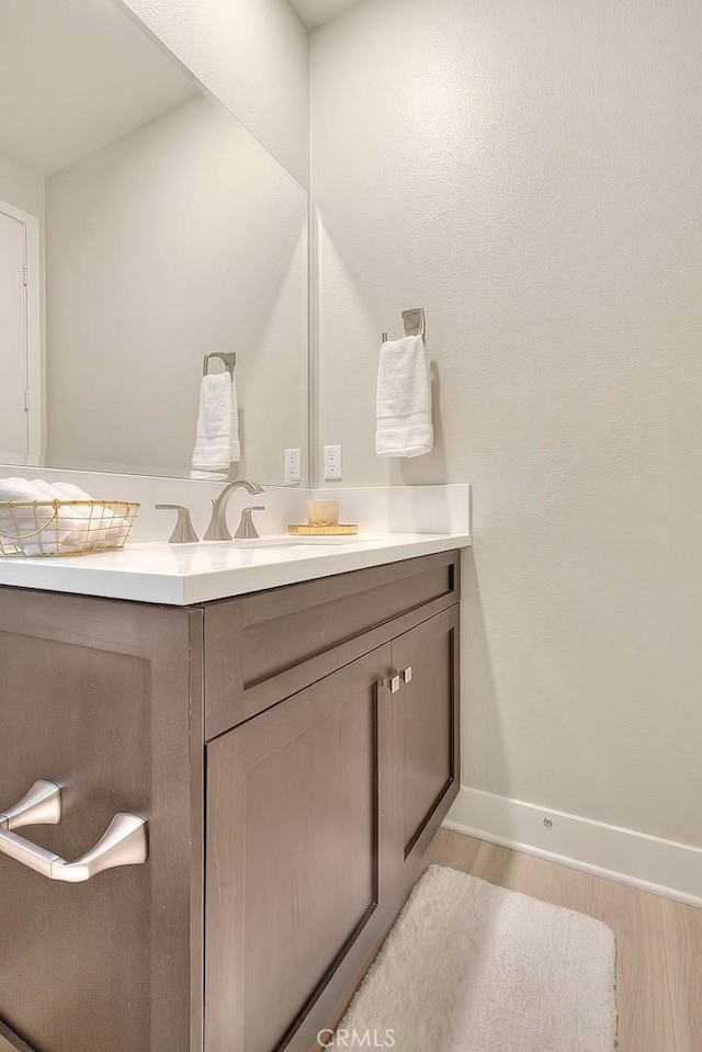 114 Source, Irvine, CA 92618 - bathroom with vanity and wood finished floors