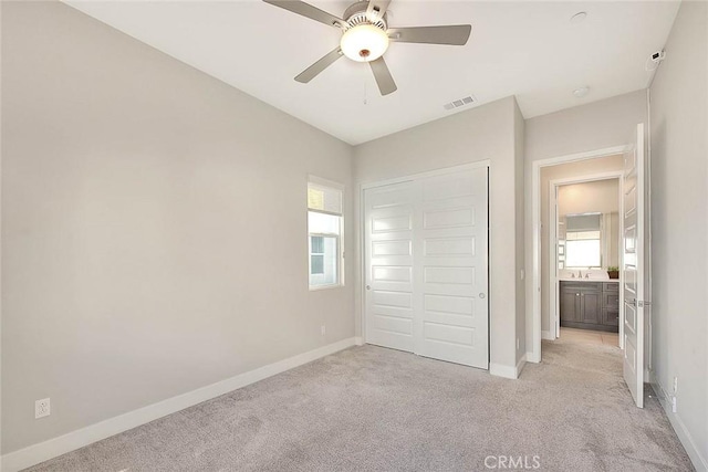 114 Source, Irvine, CA 92618 - unfurnished bedroom featuring light colored carpet, a closet, and ceiling fan