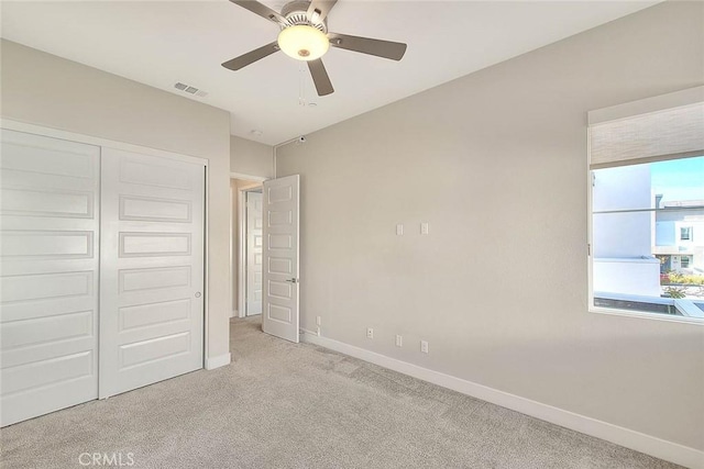 114 Source, Irvine, CA 92618 - unfurnished bedroom featuring carpet floors, a closet, and a ceiling fan