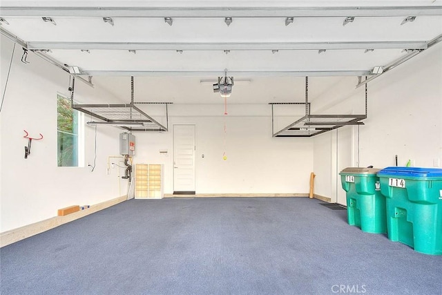 114 Source, Irvine, CA 92618 - garage featuring a garage door opener and water heater