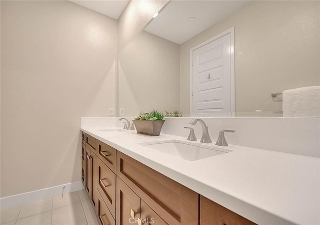 114 Source, Irvine, CA 92618 - full bath with double vanity, tile patterned flooring, and baseboards