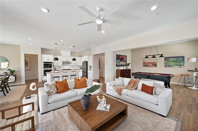 living area featuring baseboards, ceiling fan, pool table, light wood-type flooring, and recessed lighting