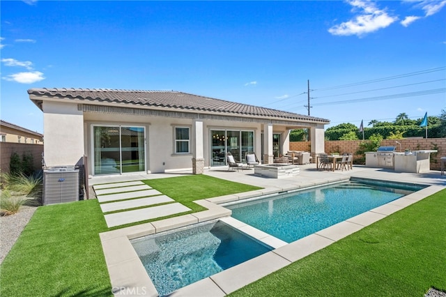 rear view of property featuring a patio, area for grilling, fence, and stucco siding