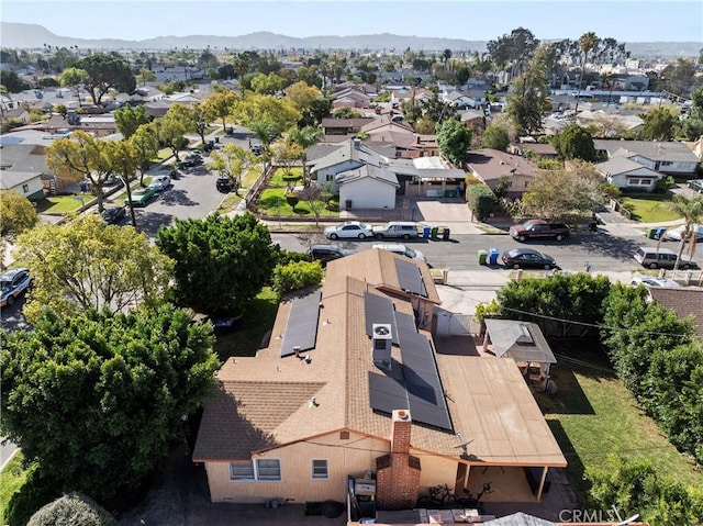 drone / aerial view with a residential view and a mountain view