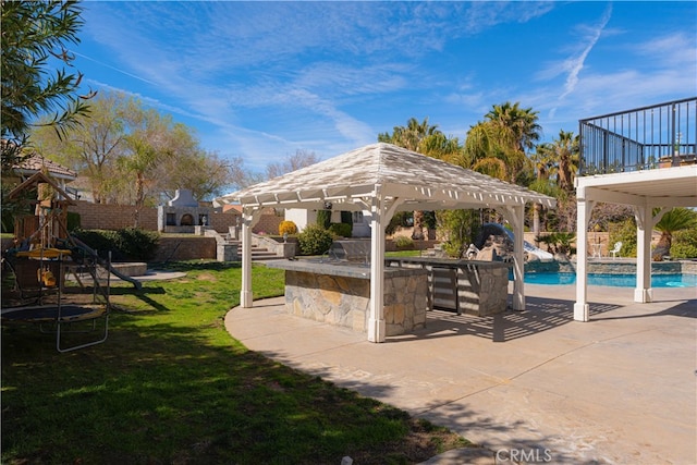 41149 Summitview Ln, Palmdale, CA 93551 - view of swimming pool featuring a gazebo, a water slide, a yard, and a patio area
