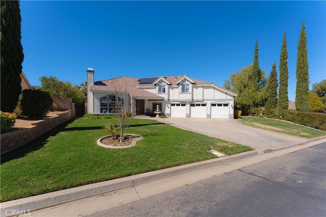 41149 Summitview Ln, Palmdale, CA 93551 - traditional-style house featuring stucco siding, solar panels, concrete driveway, a chimney, and a front yard