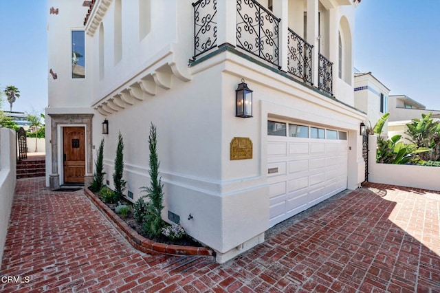 view of side of home featuring stucco siding