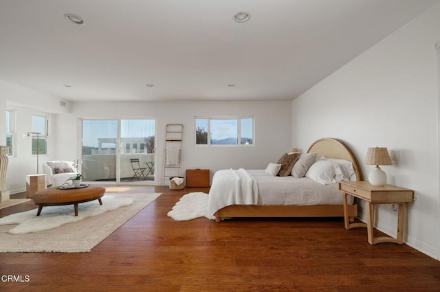 bedroom featuring recessed lighting, baseboards, and wood finished floors