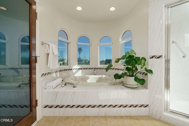 ensuite bathroom with tile patterned flooring, a shower stall, recessed lighting, and ensuite bathroom