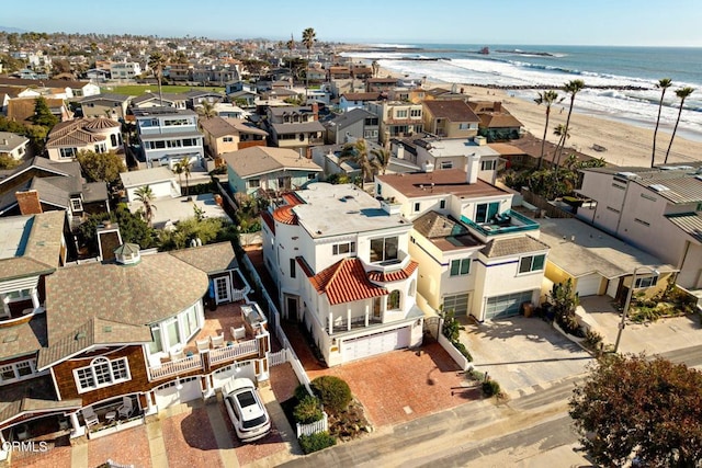 birds eye view of property with a residential view, a beach view, and a water view