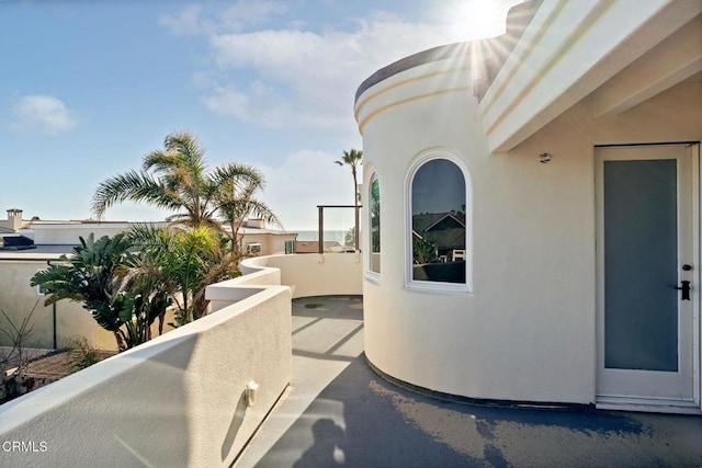 view of patio featuring a balcony