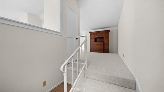 staircase with carpet and baseboards