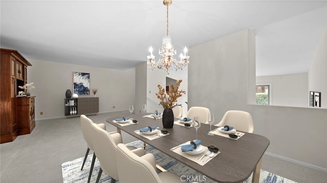 dining room with light carpet, baseboards, and an inviting chandelier