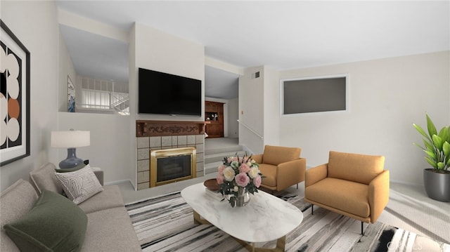 living room with carpet floors, baseboards, visible vents, and a tile fireplace