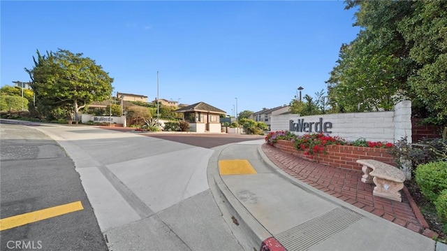 view of road with curbs and sidewalks