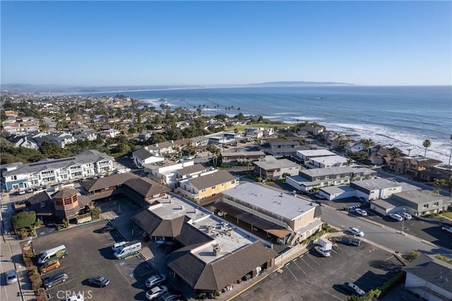 bird's eye view featuring a water view and a residential view