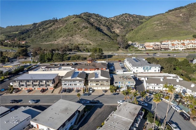 drone / aerial view featuring a residential view and a mountain view