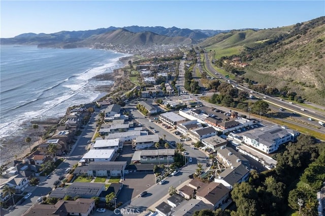 aerial view featuring a water and mountain view