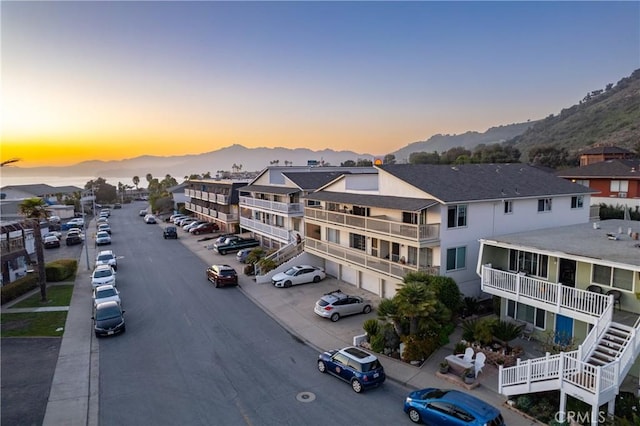 aerial view at dusk with a residential view and a mountain view