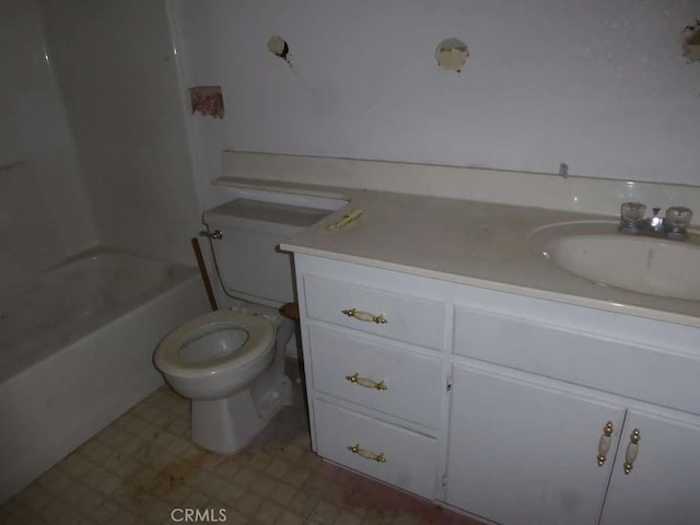 bathroom featuring toilet, vanity, and tile patterned floors