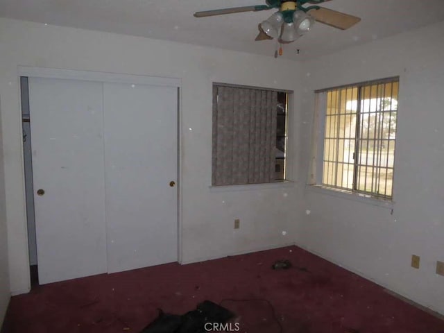 unfurnished bedroom with a closet and a ceiling fan