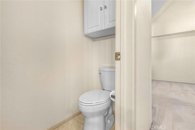 bathroom featuring toilet and tile patterned floors