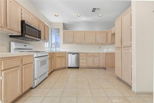 kitchen featuring recessed lighting, visible vents, light brown cabinetry, appliances with stainless steel finishes, and light tile patterned flooring