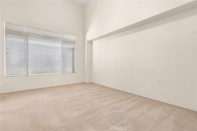 unfurnished room featuring carpet flooring