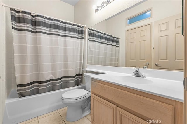 bathroom with vanity, shower / bath combo with shower curtain, toilet, and tile patterned floors