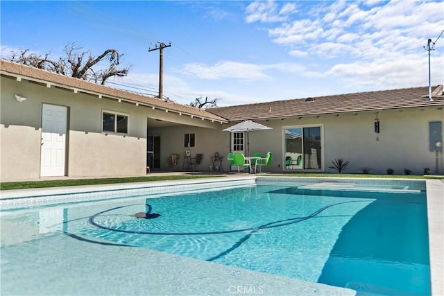 outdoor pool featuring a patio area