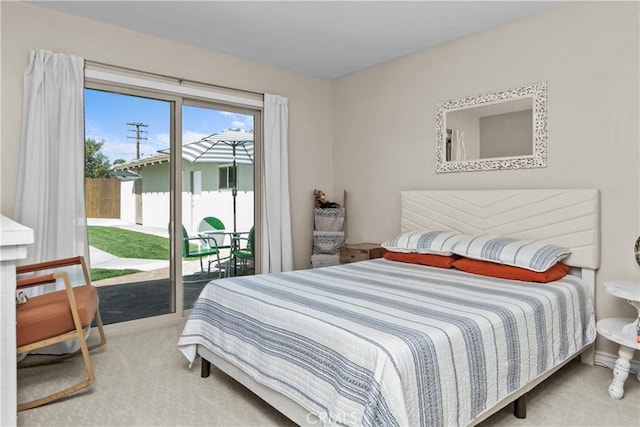 carpeted bedroom featuring access to exterior