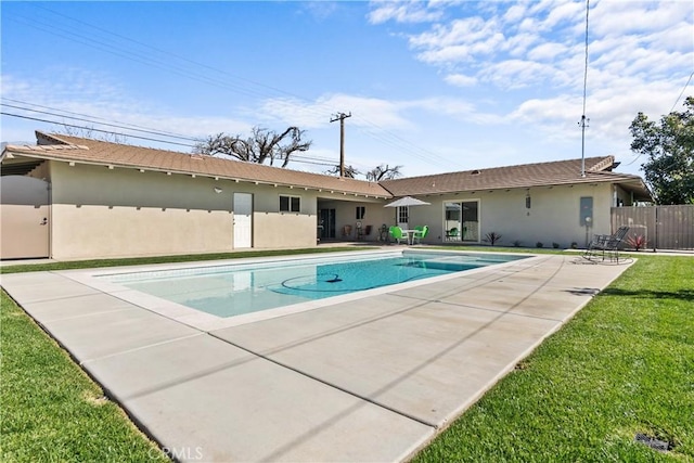 view of pool featuring a patio area, a fenced in pool, a lawn, and fence