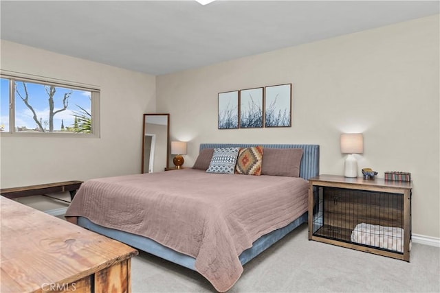 carpeted bedroom with baseboards