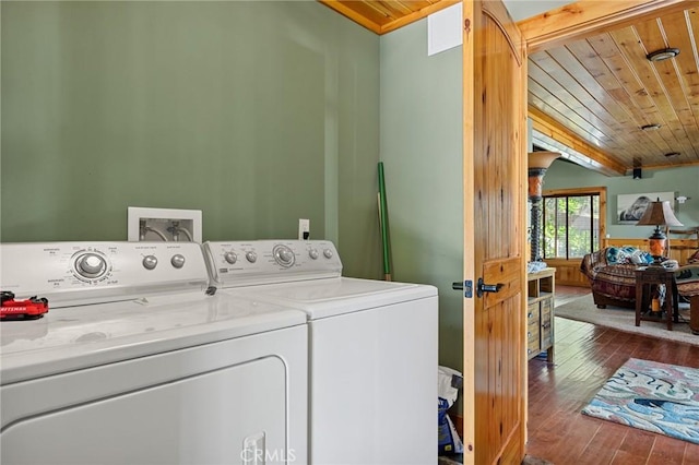 clothes washing area with wooden ceiling, washing machine and dryer, laundry area, and wood-type flooring