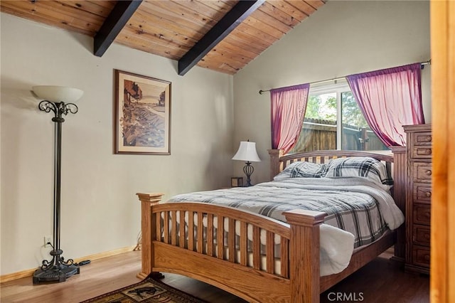 bedroom with lofted ceiling with beams, wooden ceiling, wood finished floors, and baseboards