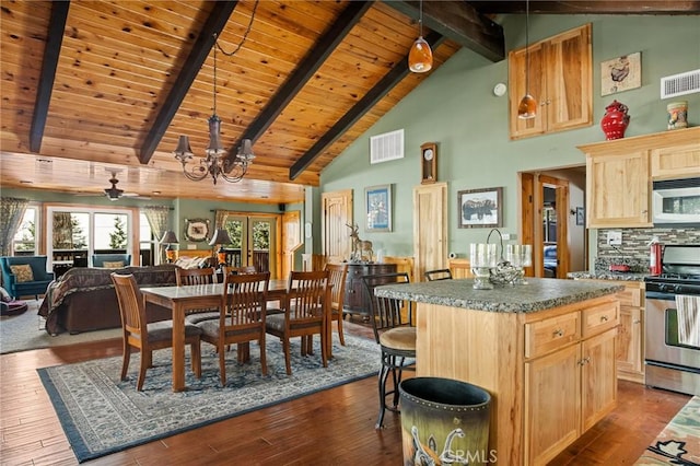 kitchen with stainless steel appliances, visible vents, dark wood-type flooring, and light brown cabinetry