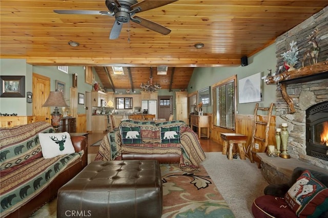 living room featuring lofted ceiling, wooden ceiling, ceiling fan with notable chandelier, and wainscoting